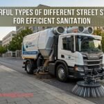 A powerful modern industrial vehicle operating among different street sweepers to clean a city road.